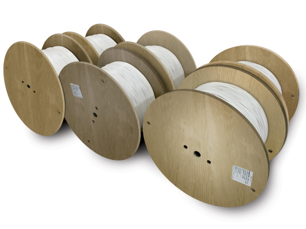 Toner Plastics PVC filler wound on custom reels for a fiber optic cable application.