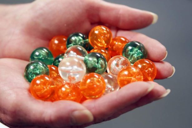 The Beadery, in Hope Valley, owned by Toner Plastics, is producing over 350,000 round acrylic beads for a large art installation called 360 degree Vanishing Point in Houston TX. Barbara Gordon, the sales and marketing manager holds some of the beads that are being shipped to Texas.